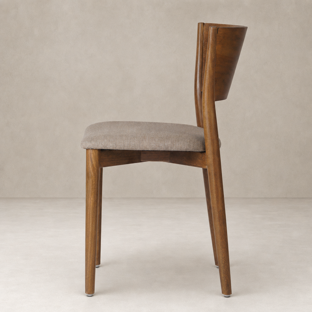 Hayes Dining Chair in Alcala Taupe featuring a curved back and tapered wooden legs.