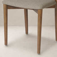 Hayes Dining Chair in Alcala Taupe with sleek wooden legs and comfortable fabric seat.