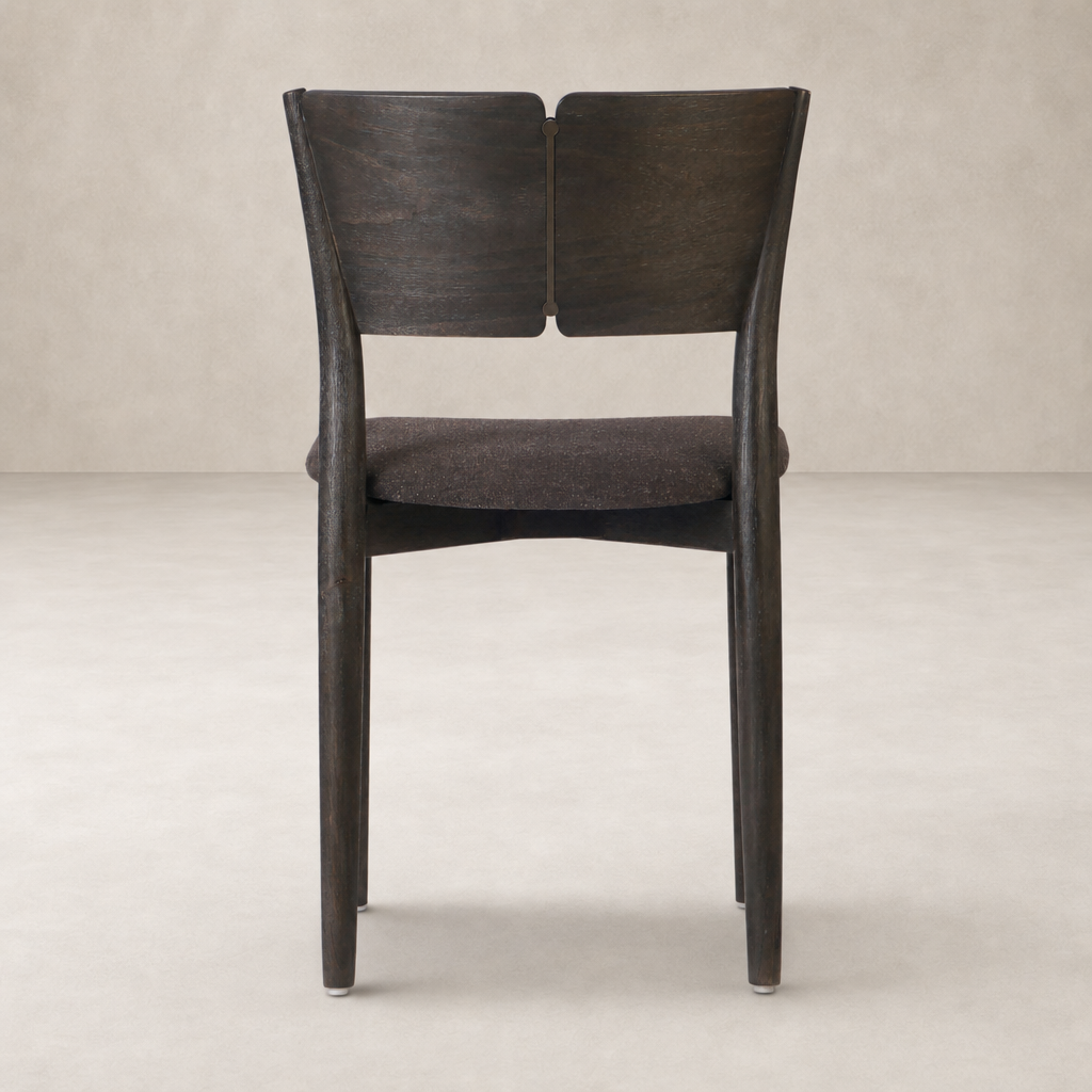 Hayes Dining Chair with a sleek Antwerp Noir finish and modern, curved wooden back.