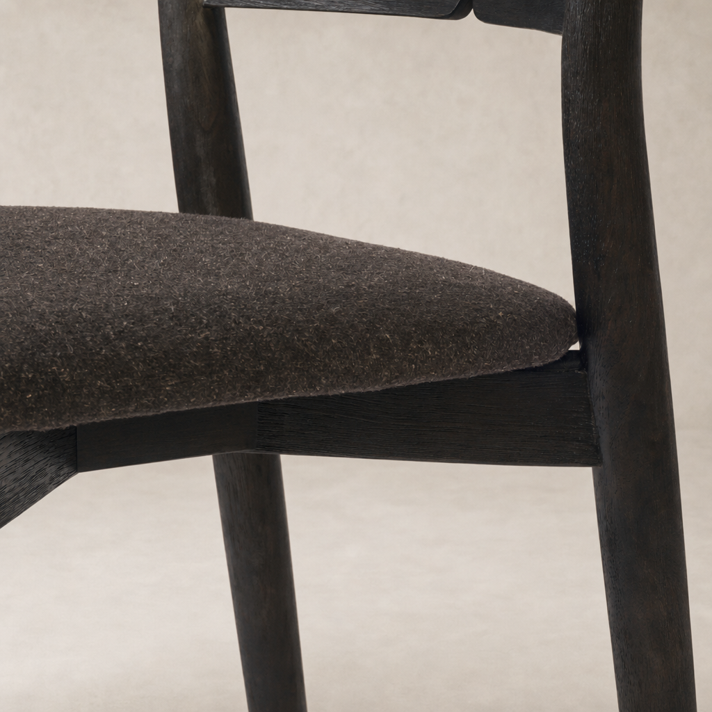 Hayes Dining Chair in Antwerp Noir featuring a soft, textured fabric seat and sleek wooden frame.