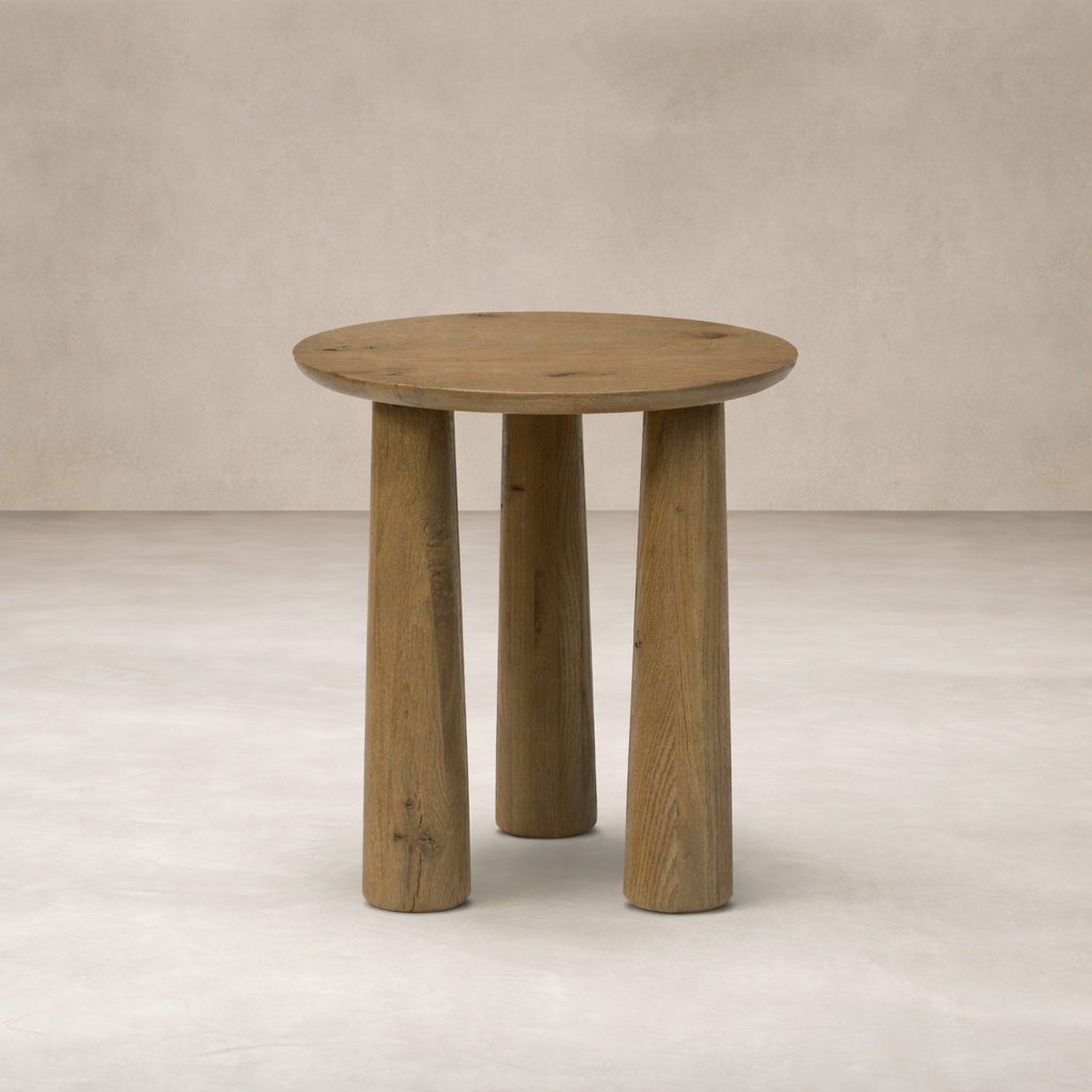 Front view of the Drift Nesting End Table featuring a round top and sturdy, textured wooden legs.