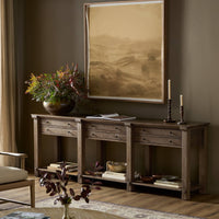 Willowdale Console Table in tan oak featuring three drawers and a sleek design.
