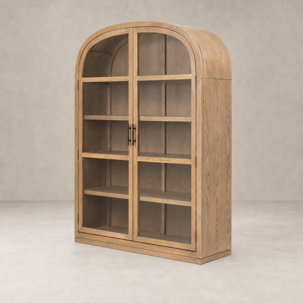 Wide cabinet in drifted smoked oak with arched top and glass doors.