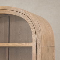 Wide cabinet in drifted smoked oak with rounded edges and shelving.