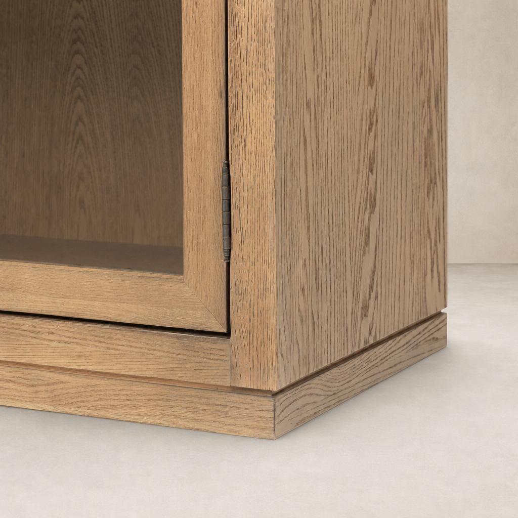 Close-up of a wide cabinet in drifted smoked oak with detailed hinge and texture.