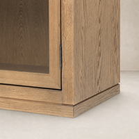 Close-up of a wide cabinet in drifted smoked oak with detailed hinge and texture.