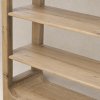Orion Bookcase in aged natural oak with smooth shelves and rounded edges.