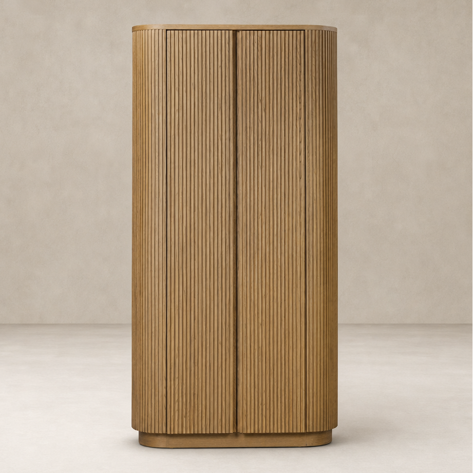 Beatrix Cabinet in Desert Oak featuring vertical slats and rounded edges.