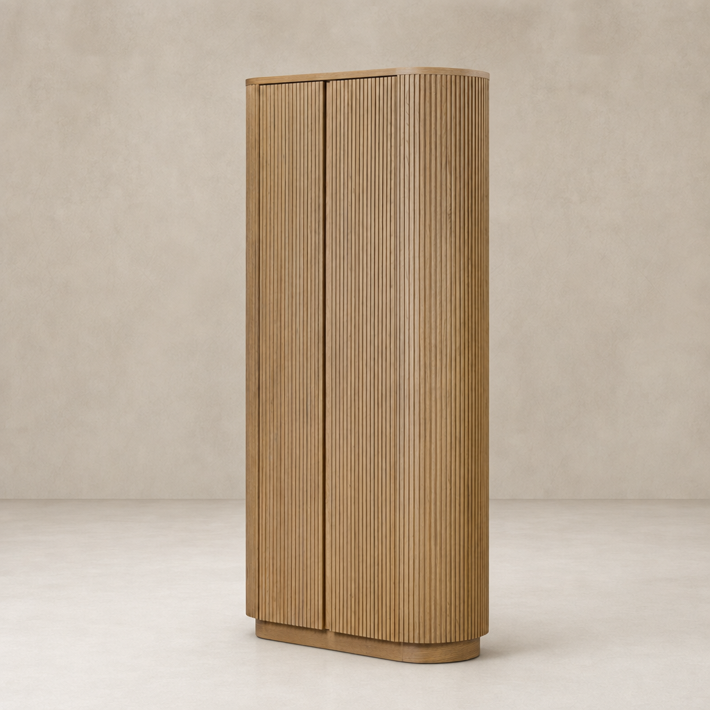 Beatrix Cabinet in Desert Oak featuring a sleek, curved design and grooved texture.