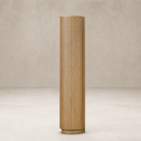 Beatrix Cabinet in Desert Oak with a sleek, cylindrical design and vertical ribbed texture.