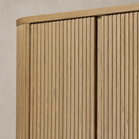 Close-up of Beatrix Cabinet in Desert Oak showcasing detailed ribbed texture.