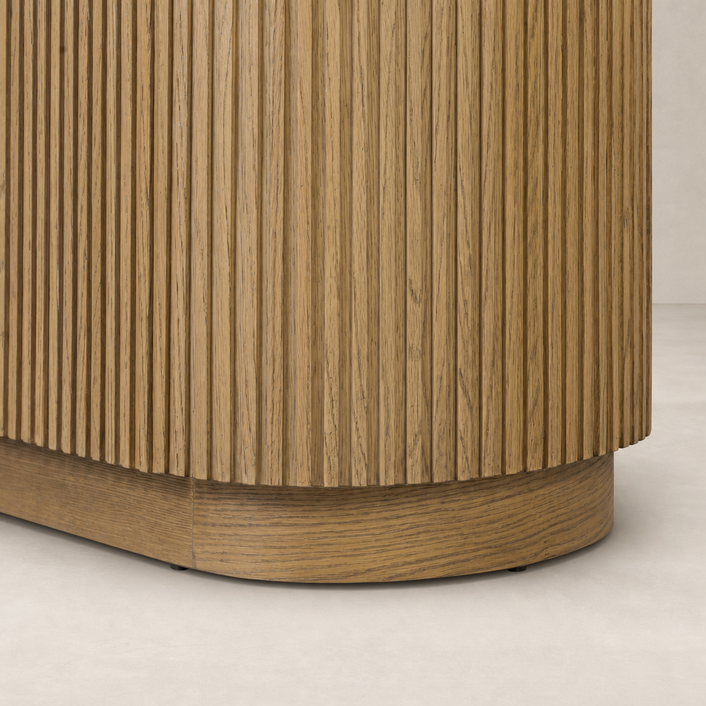 Beatrix Cabinet features a textured Desert Oak finish with vertical grooves.