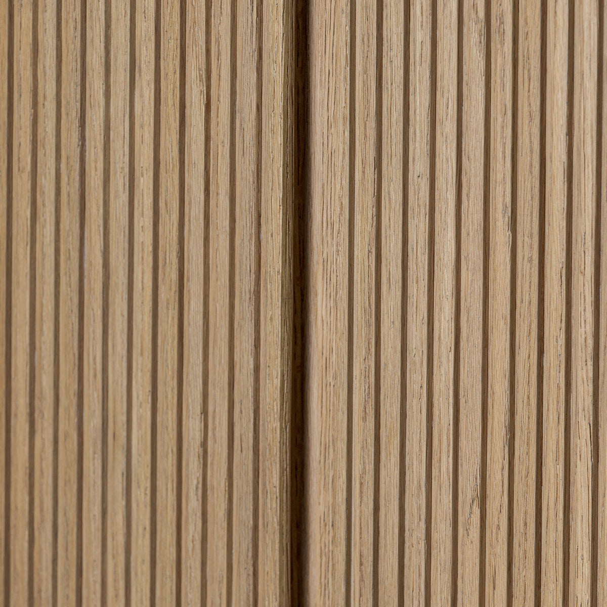 Close-up of Beatrix Cabinet in Desert Oak showcasing its textured, ribbed finish.