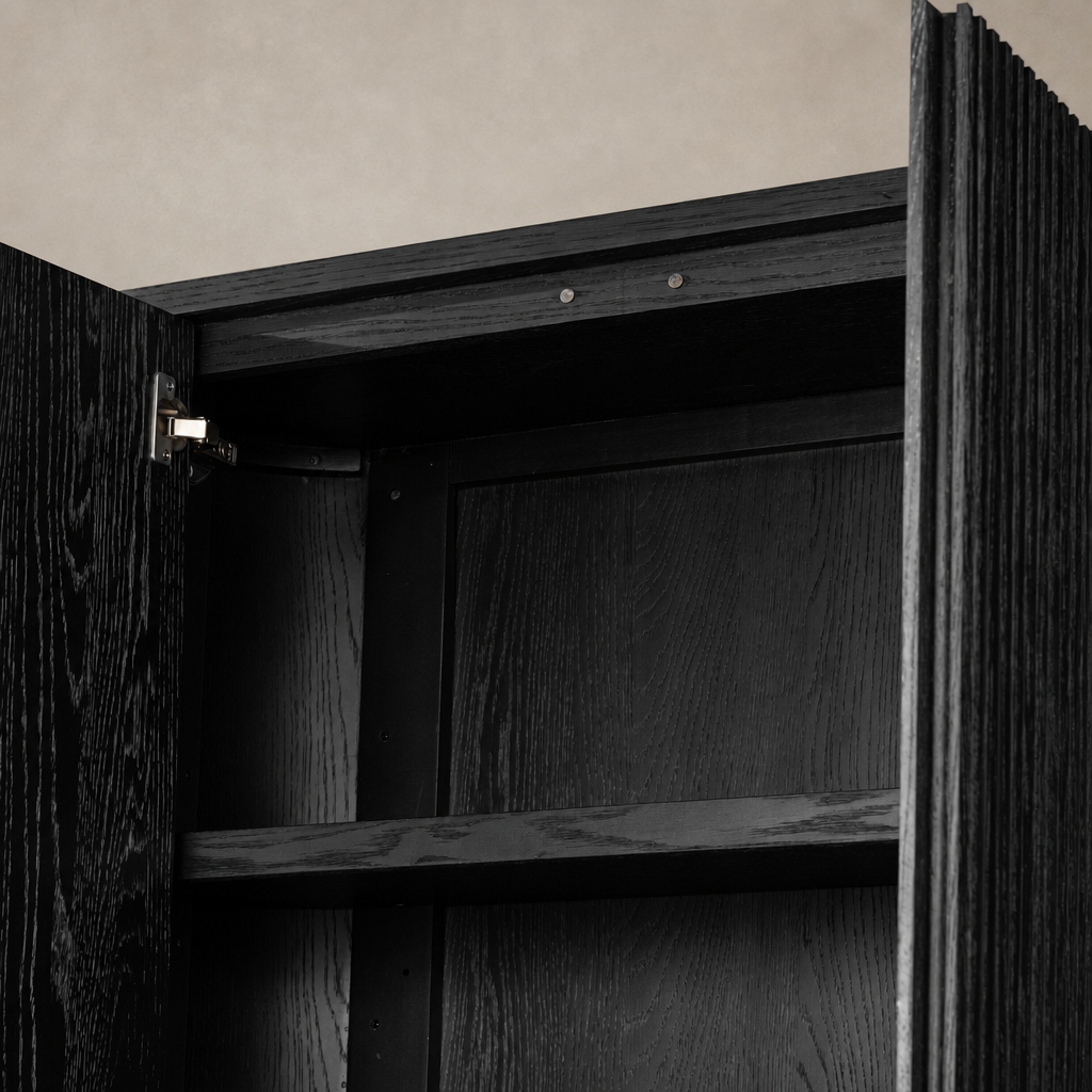 Beatrix Cabinet in cerused black oak, showcasing sleek lines and interior shelves.