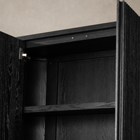 Beatrix Cabinet in cerused black oak, showcasing sleek lines and interior shelves.