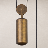Burnished brass aluminum pendant light with a cylindrical shape and minimalist design.