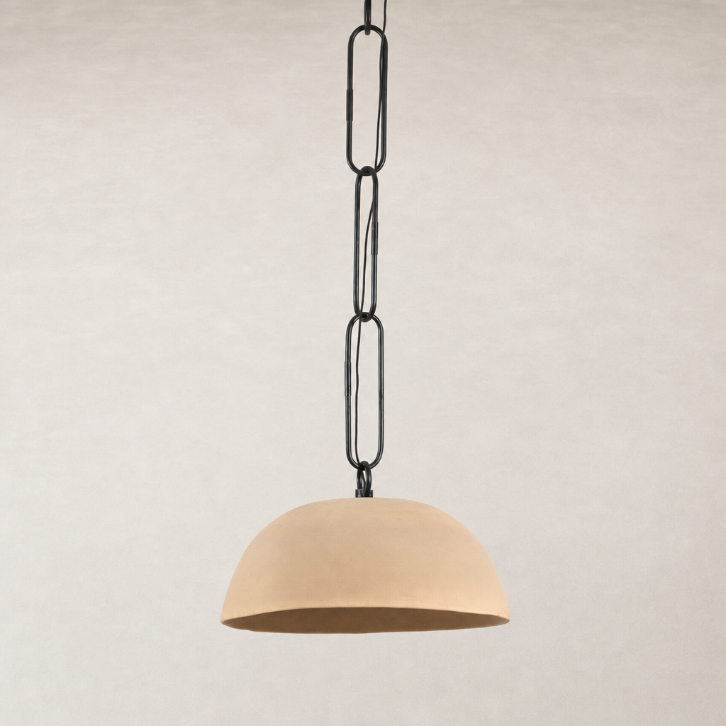 Tan speckled ceramic pendant lamp hanging from a black chain.