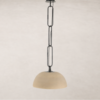 Tan speckled ceramic pendant light with a black chain and ceiling mount.