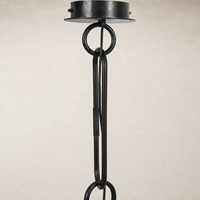 Tan speckled ceramic pendant light with a modern black hanging design.