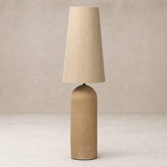 Tan speckled ceramic floor lamp with a conical beige shade.