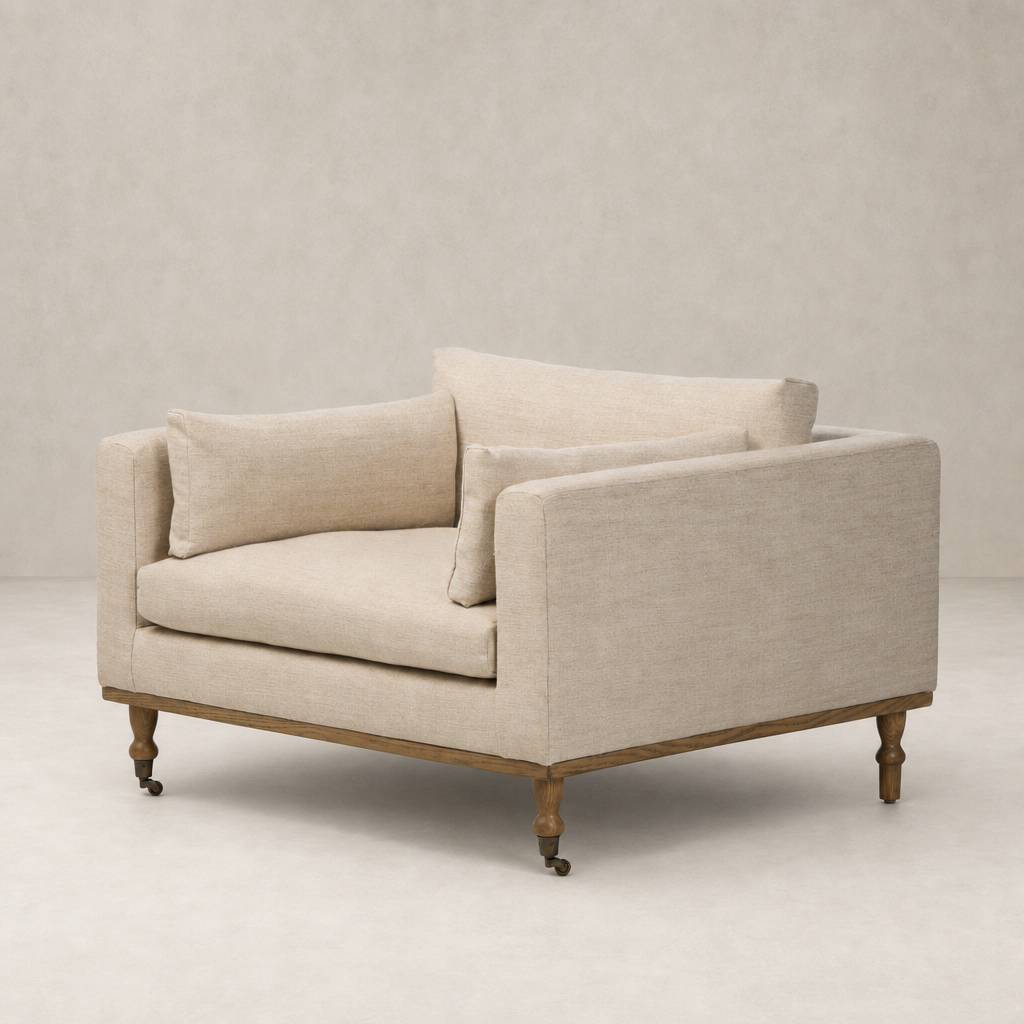 Savannah Chair in Alcala Wheat with plush cushions and a wooden base.