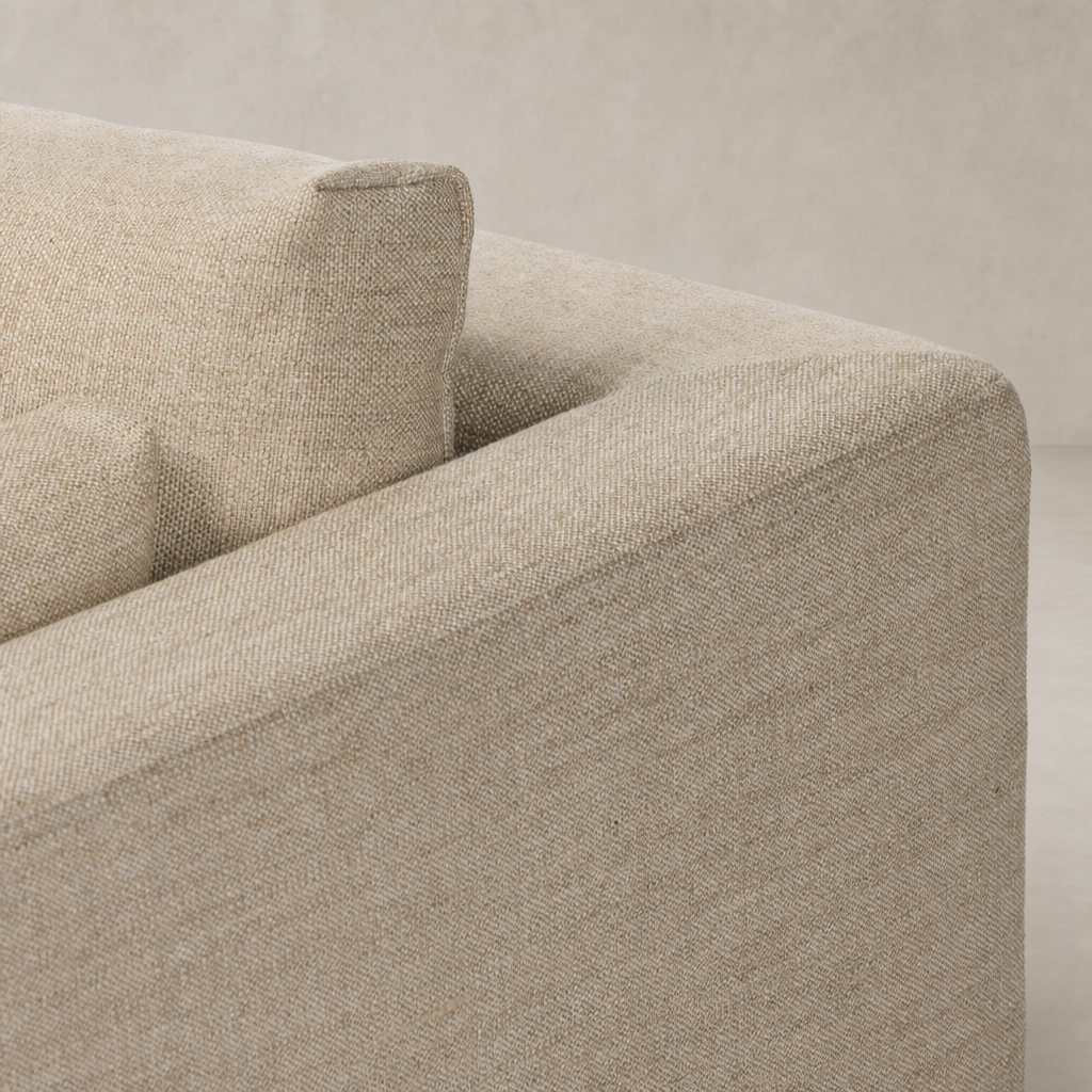 Savannah Chair in Alcala Wheat showing textured fabric and plush cushion detail.