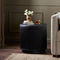 Sleek Roselle End Table in black featuring a ribbed texture and round top.