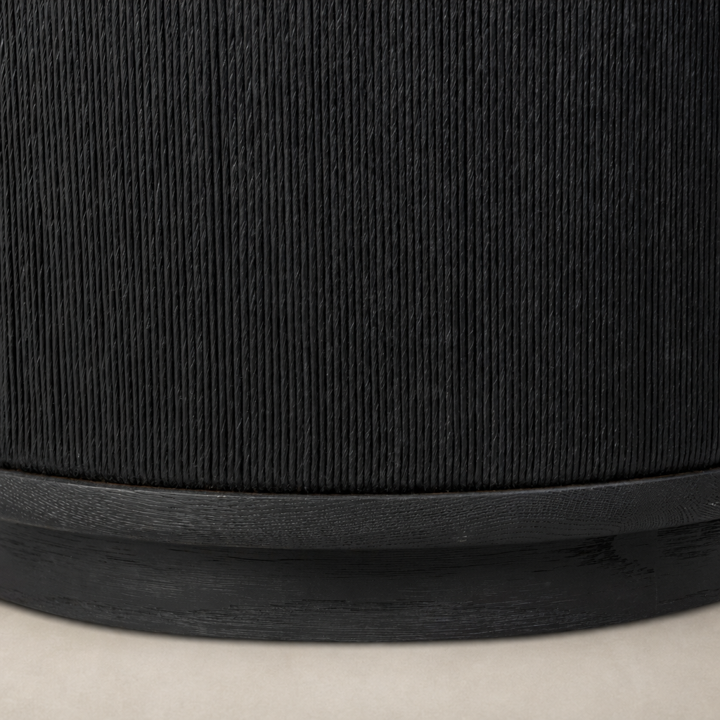 Roselle End Table featuring a textured black finish and sleek circular base.