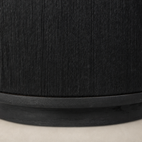 Roselle End Table featuring a textured black finish and sleek circular base.