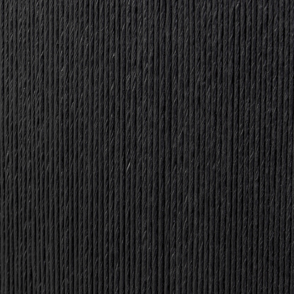 Close-up of Roselle End Table's textured black surface showing elegant vertical lines.