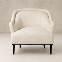 Wells Chair in Thames Cream featuring a curved back and soft upholstery.