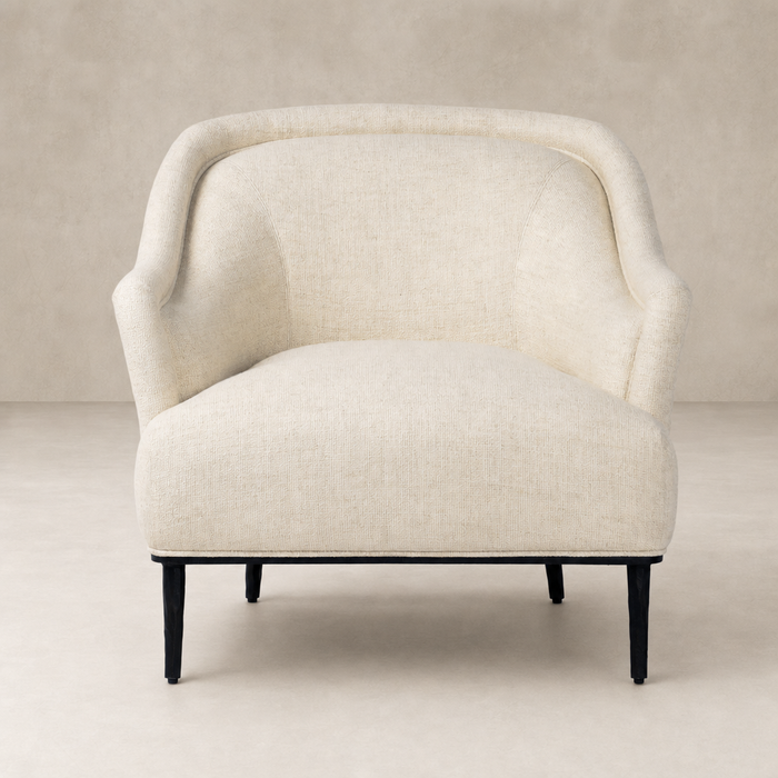 Wells Chair in Thames Cream featuring a curved back and soft upholstery.