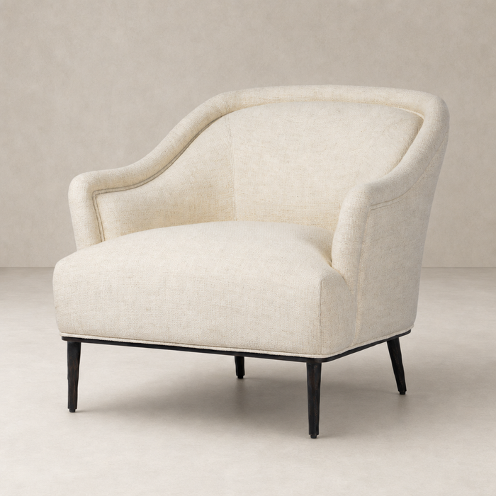 Wells Chair in Thames Cream features a curved back and sleek legs.