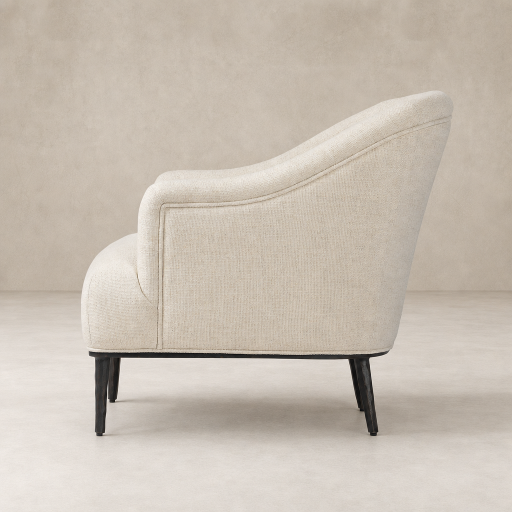 Wells Chair in Thames Cream showcases a sleek silhouette with textured upholstery.