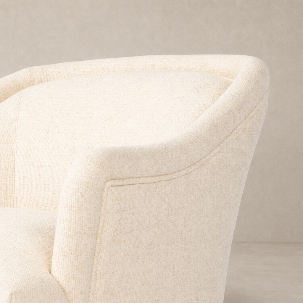 Wells Chair in Thames Cream featuring a smooth, curved design and textured fabric.