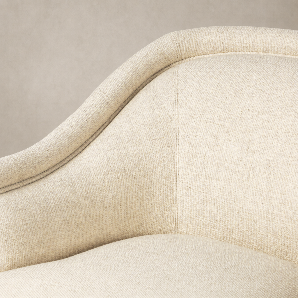 Wells Chair in Thames Cream, showcasing soft, textured fabric and elegant curved design.