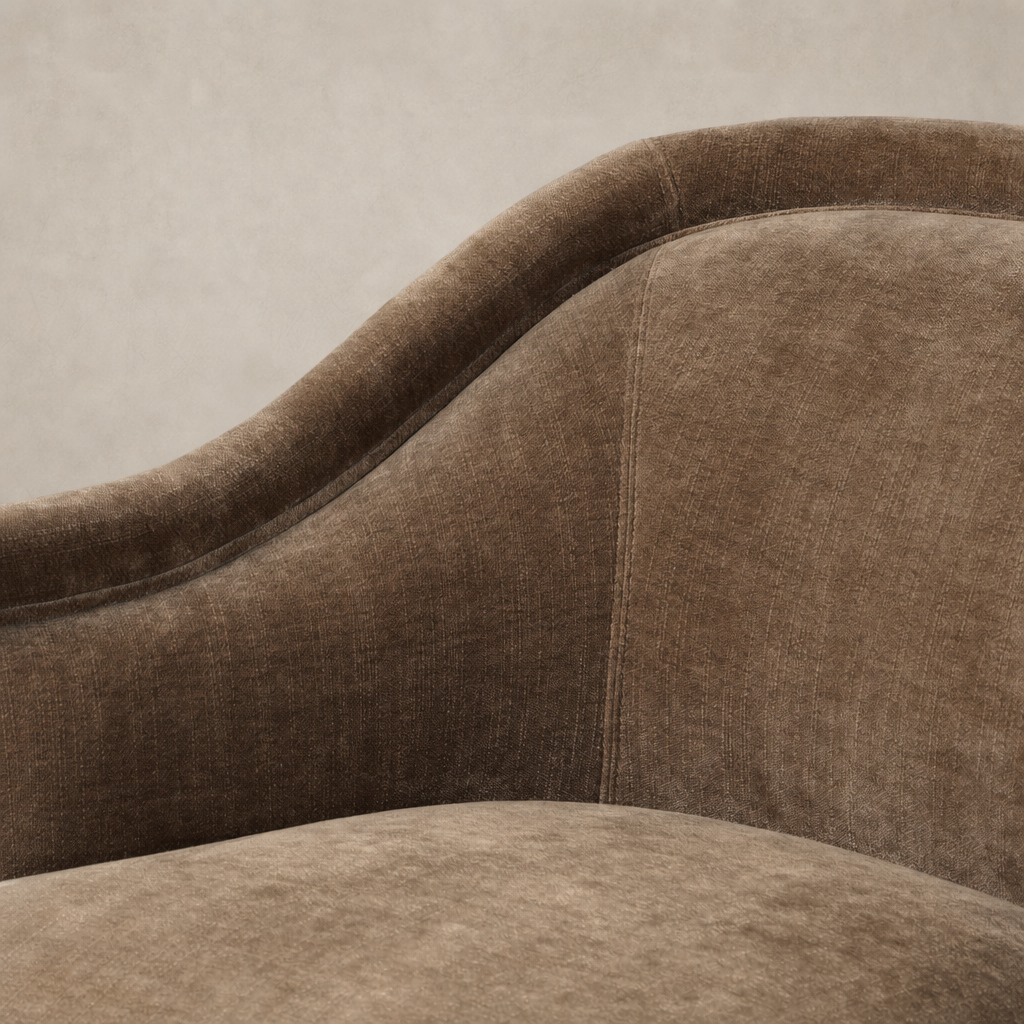 Soft Altair Mushroom upholstery of the Wells Chair showcasing its curved design and texture.