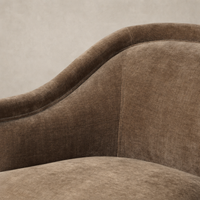 Soft Altair Mushroom upholstery of the Wells Chair showcasing its curved design and texture.