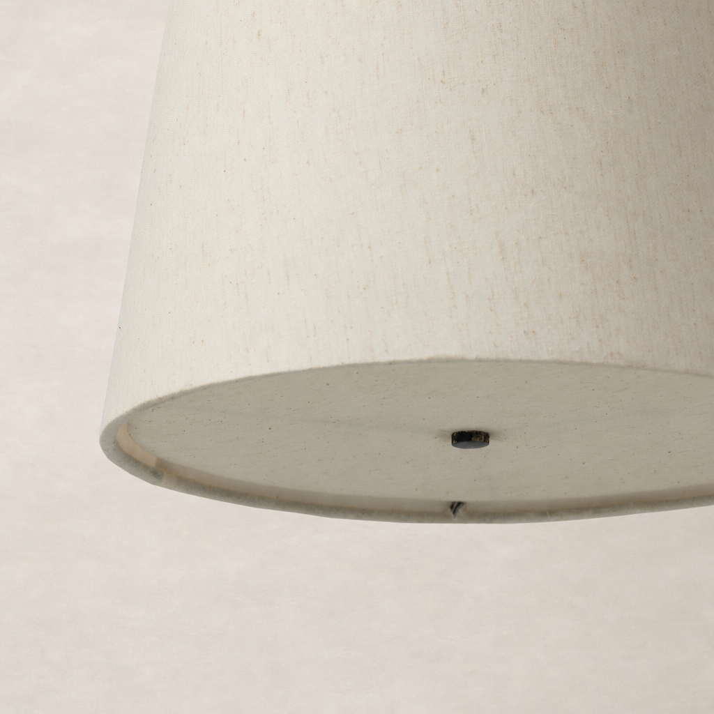 Jet black pendant light featuring a sleek, modern design with a smooth finish.