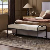 Side view of the Rune Accent Bench featuring a plush cream seat and elegant black metal frame.