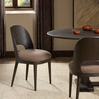 Hawthorne Dining Chair in Laughlin Cafe, featuring a sleek wooden design and plush seat.