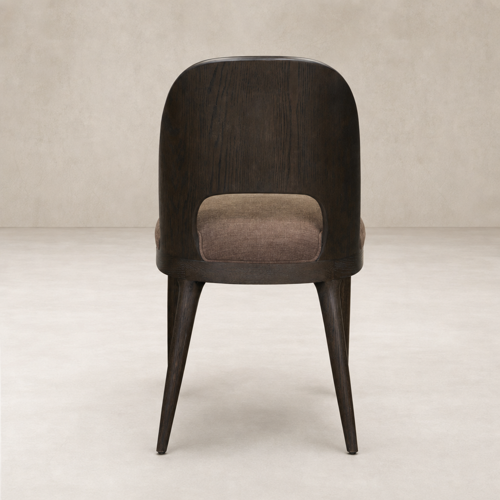 Hawthorne Dining Chair in Laughlin Cafe featuring a rounded back and sturdy wooden legs.