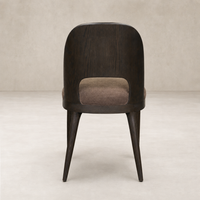 Hawthorne Dining Chair in Laughlin Cafe featuring a rounded back and sturdy wooden legs.