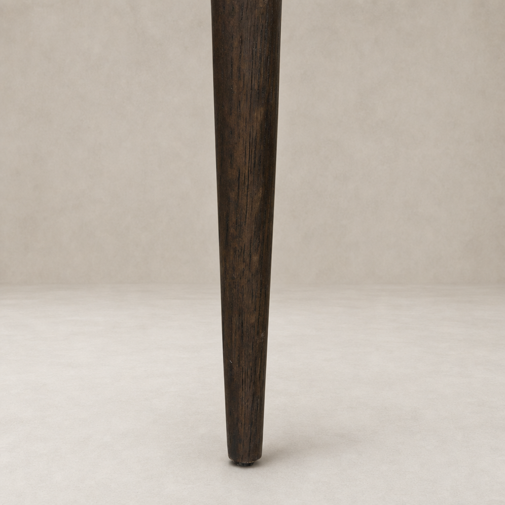 Hawthorne Dining Chair leg in Laughlin Cafe finish showcasing rich wood texture.