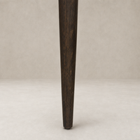 Hawthorne Dining Chair leg in Laughlin Cafe finish showcasing rich wood texture.