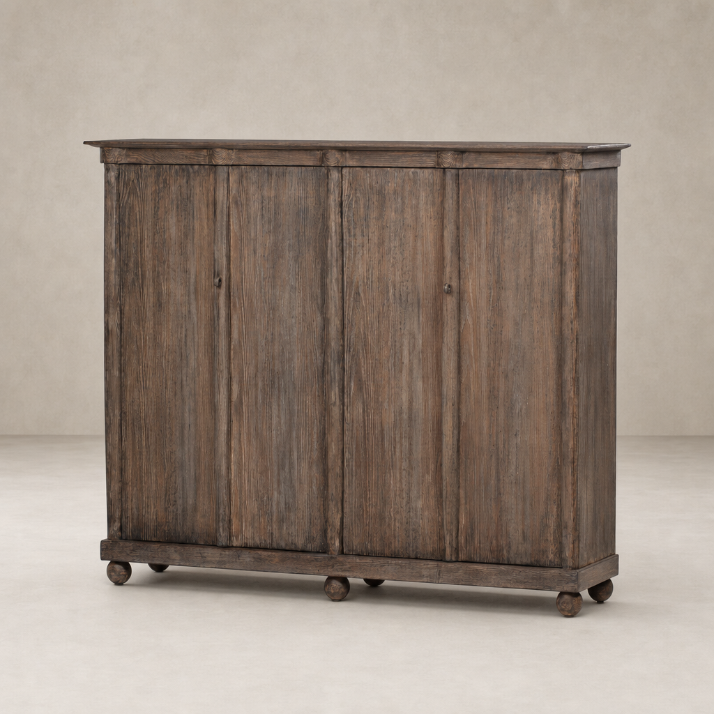 Lisbon Cabinet in distressed cocoa pine with four doors and round feet.