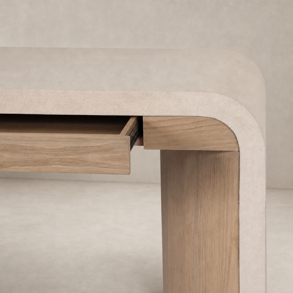 Kyoto Desk in Sandy Oak featuring a rounded edge and a sleek pull-out drawer.