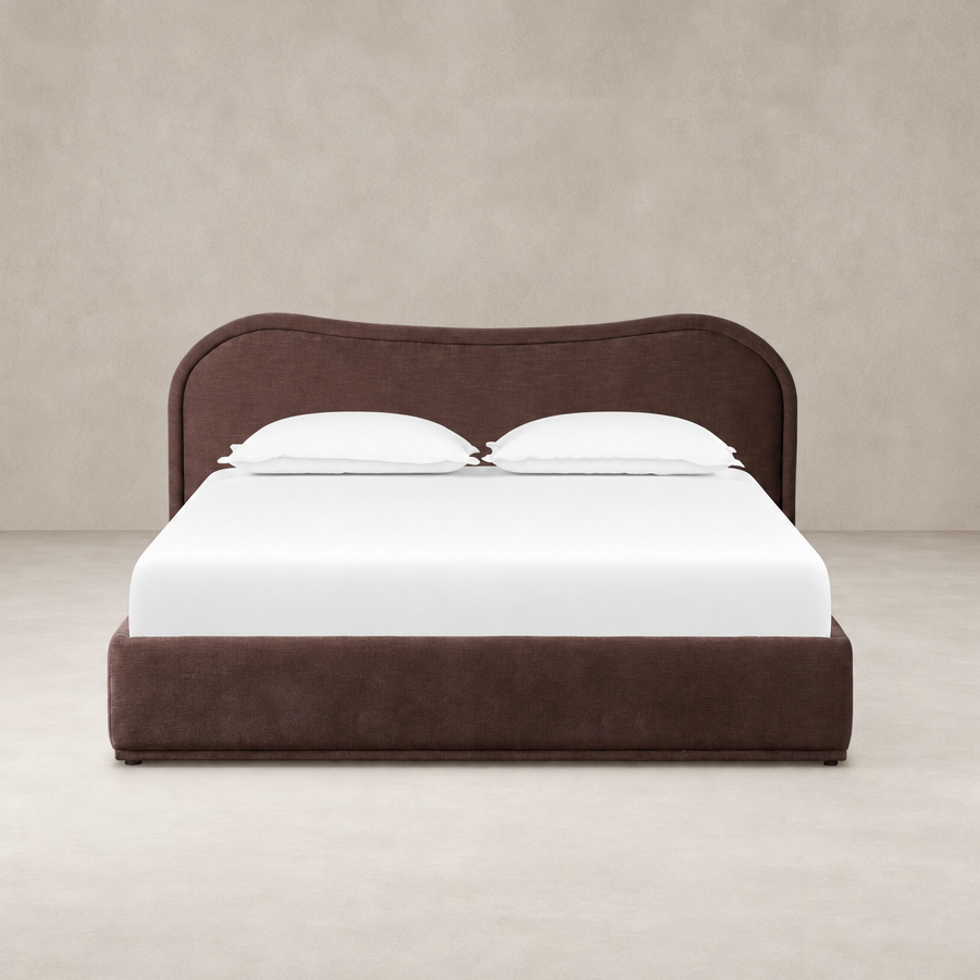 Plush Laughlin Plum bed featuring a curved headboard and clean lines.