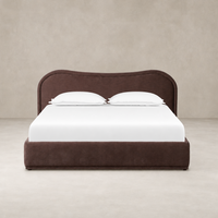 Plush Laughlin Plum bed featuring a curved headboard and clean lines.