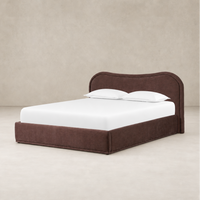 Plum upholstered bed with a curved headboard and clean lines.